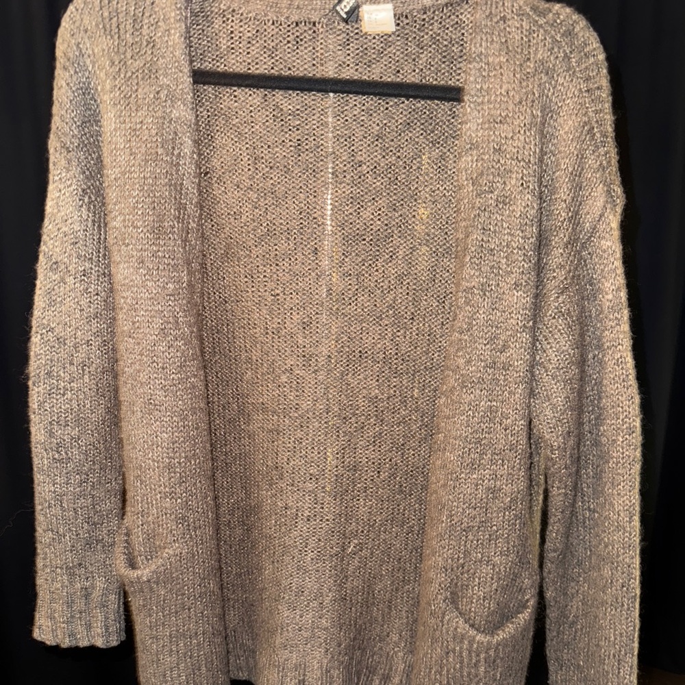 brown knitted sweater with black elbow patches